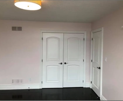 Bedroom with large window painted freshly